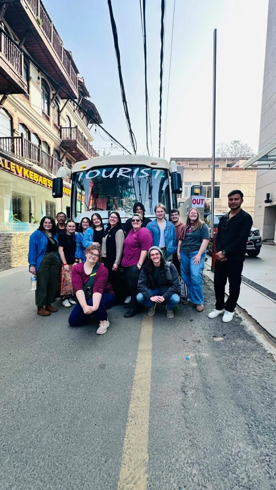 Happy tourists with our transport